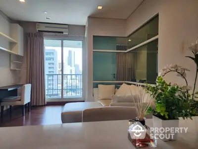 Modern living room with balcony view in high-rise apartment