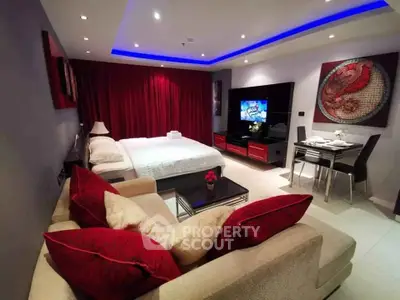 Luxurious studio apartment with modern decor, featuring a cozy bed, stylish sofa, and elegant dining area.