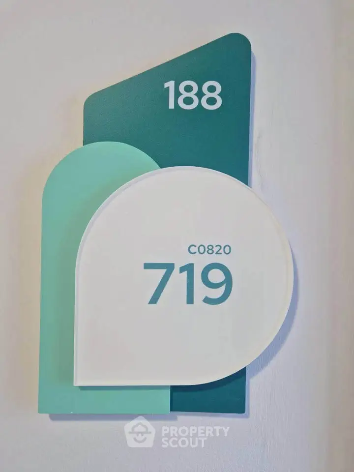 Modern apartment number sign with stylish design and bold numbers for easy identification.