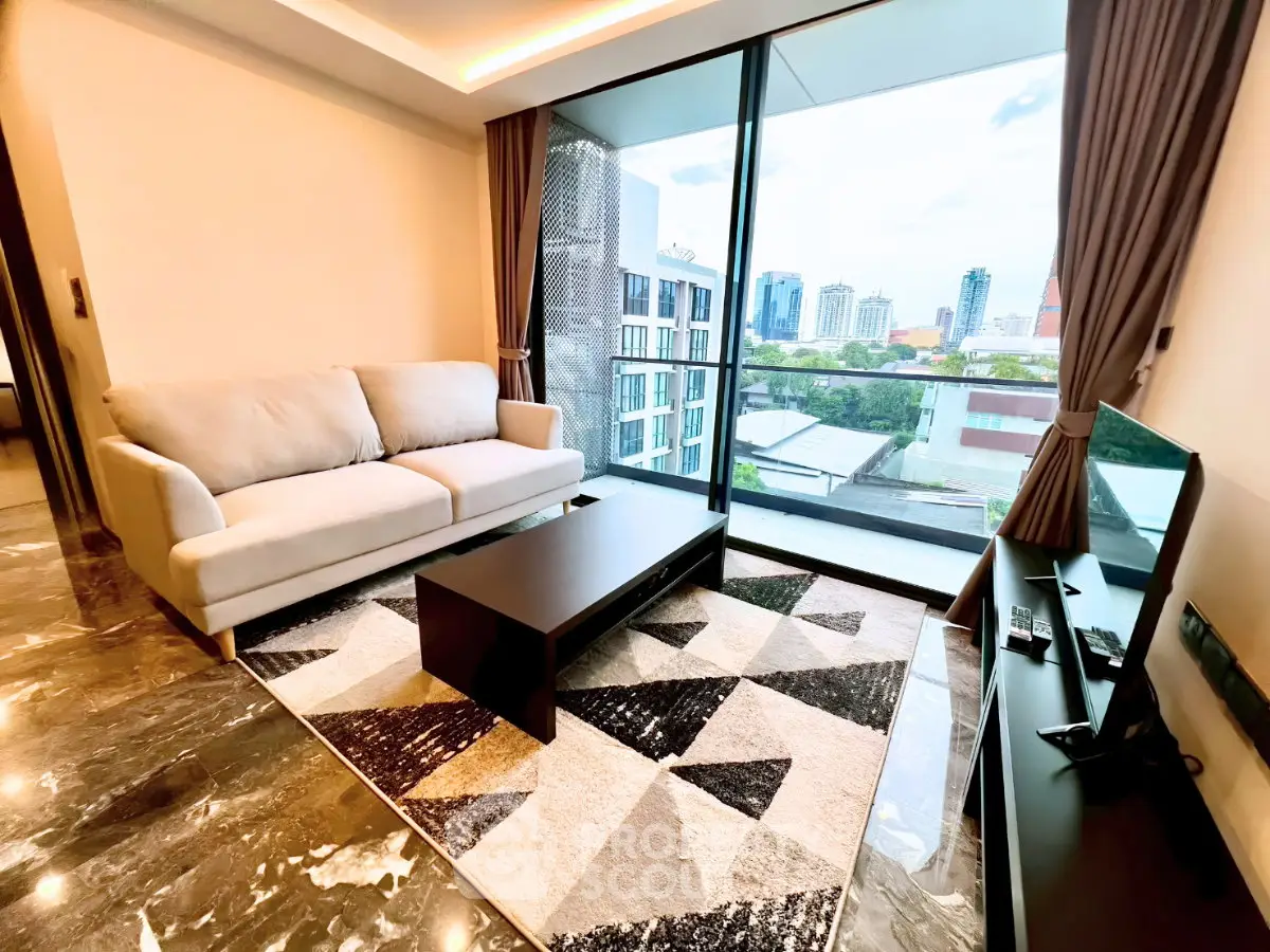 Modern living room with city view, stylish decor, and large windows in a high-rise apartment.