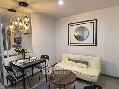 Modern living room with stylish lighting and cozy dining area