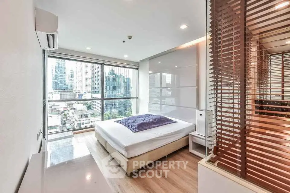 Modern bedroom with city view and stylish interior design