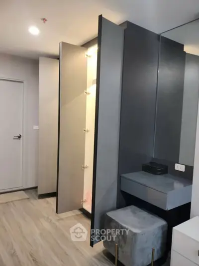 Modern bedroom with sleek wardrobe and stylish vanity area