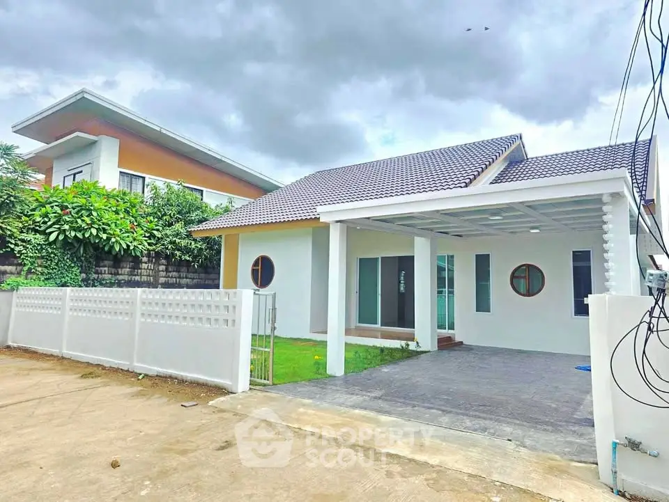 Charming modern house with spacious driveway and lush greenery, perfect for family living.