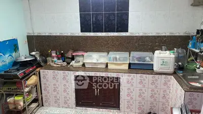 Charming kitchen with closed layout and ample storage space