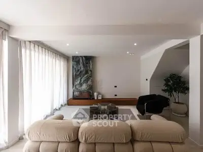 Spacious modern living room with elegant decor and natural light