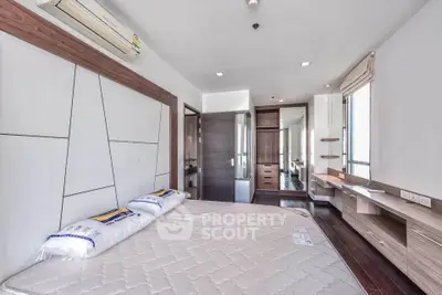 Spacious modern bedroom with sleek design and ample natural light