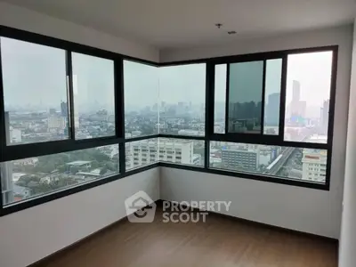 Spacious corner unit with panoramic city views and large windows, perfect for urban living.