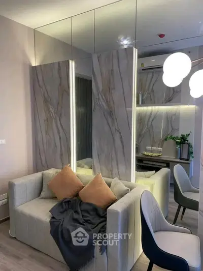 Modern living room with stylish decor and cozy seating in a contemporary apartment.