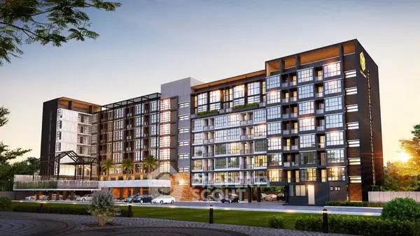 Modern apartment building exterior with sunset view and lush surroundings.