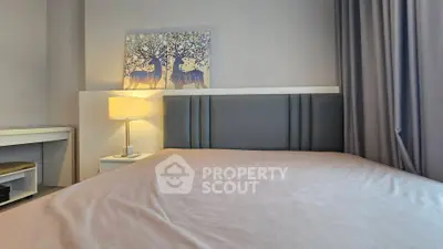 Cozy bedroom with modern decor and soft lighting, perfect for relaxation.