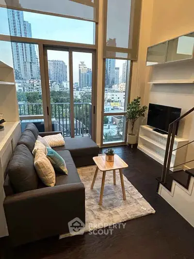 Modern living room with city view, featuring stylish furniture and floor-to-ceiling windows.