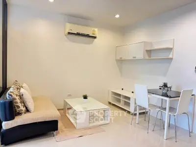 Modern living room with sleek furniture and air conditioning, perfect for cozy gatherings.