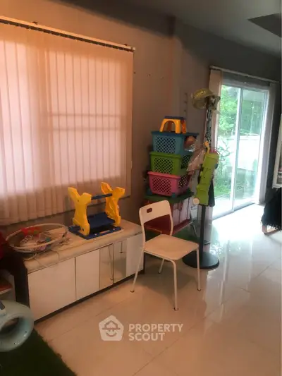 Cozy interior space with natural light and modern decor, ideal for family living.
