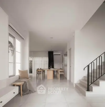 Spacious modern living room with elegant dining area and staircase