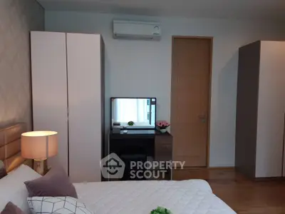 Modern bedroom with stylish decor and ample storage space