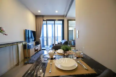 Modern living room with dining area and balcony view in a stylish apartment.