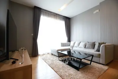 Modern living room with sleek furniture and natural light