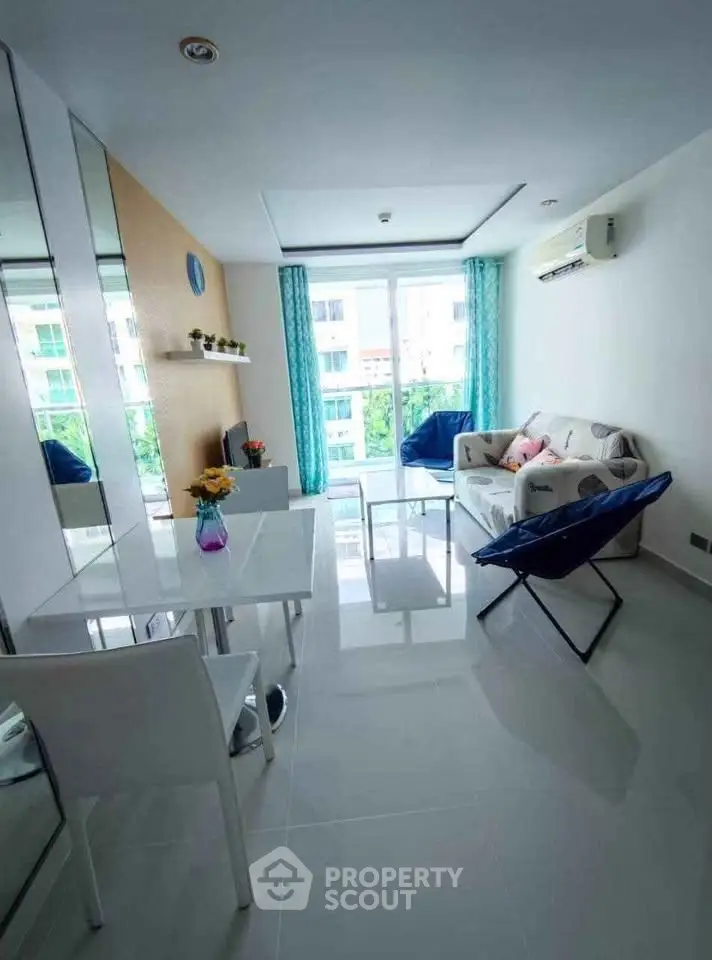 Bright modern living room with large windows and stylish furniture in a contemporary apartment.