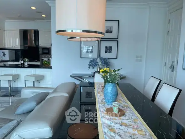 Luxurious modern living room with elegant decor and open kitchen layout, perfect for stylish urban living.