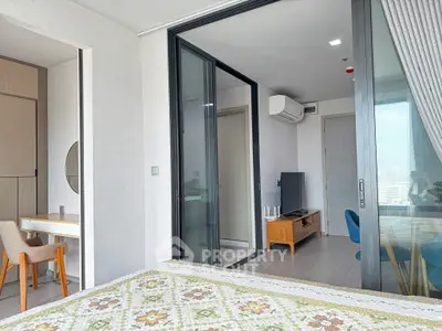 Modern bedroom with sliding glass doors and stylish decor