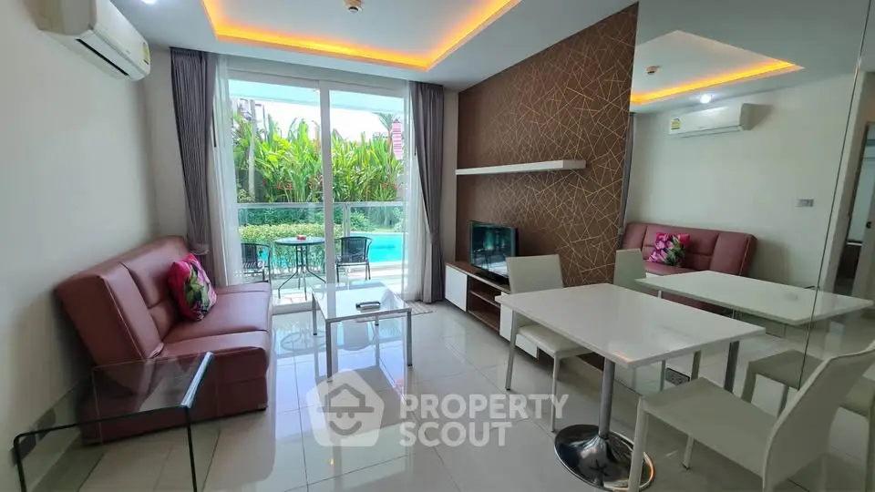 Modern living room with pool view, stylish decor, and natural light in a luxury apartment.