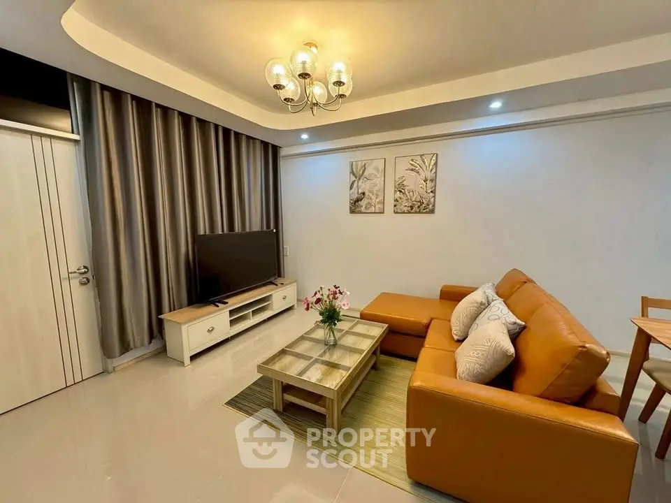 Stylish living room with modern decor and cozy seating area, perfect for relaxation and entertainment.