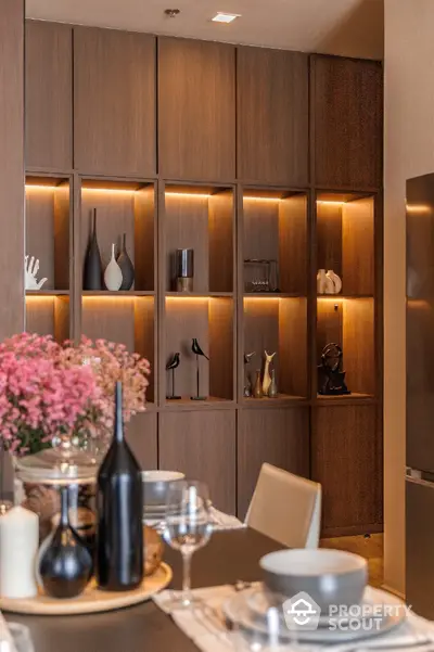 Elegant dining area with stylish decor and wooden shelving