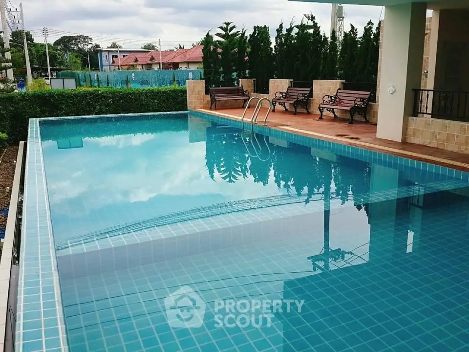 Luxurious residential pool with serene surroundings and elegant design.
