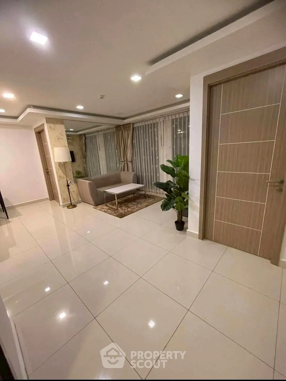 Spacious modern living room with elegant decor and large windows