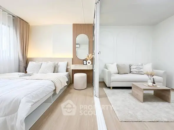 Modern studio apartment with cozy bedroom and stylish living area, featuring elegant decor and natural light.