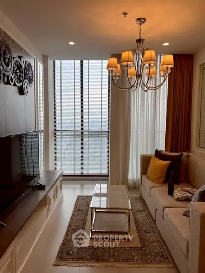 Luxurious living room with elegant chandelier and modern decor