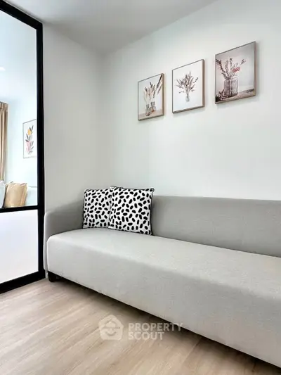Modern living room with sleek gray sofa and stylish decor