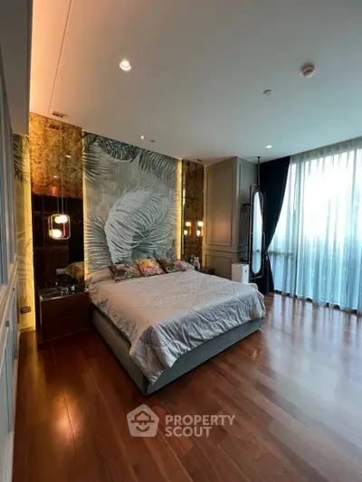 Luxurious bedroom with elegant decor and large windows offering natural light.