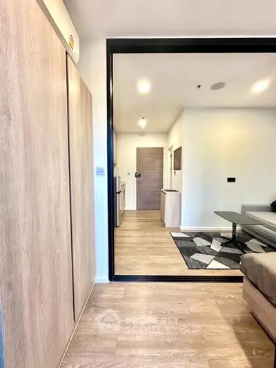 Modern living room with wooden flooring and stylish furniture