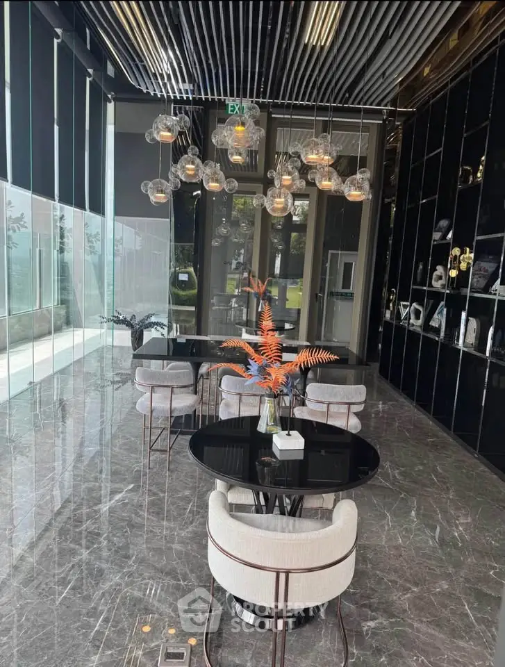 Luxurious modern lobby with elegant lighting and marble flooring in a high-end building.