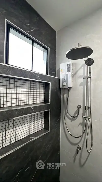 Modern bathroom with sleek shower and built-in shelving