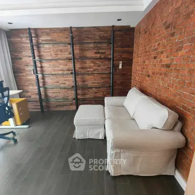 Stylish living room with brick accent wall and modern furniture