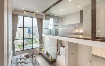 Modern loft apartment with large windows and city view, featuring stylish interior design.