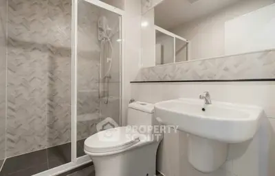 Modern bathroom with glass shower and sleek fixtures