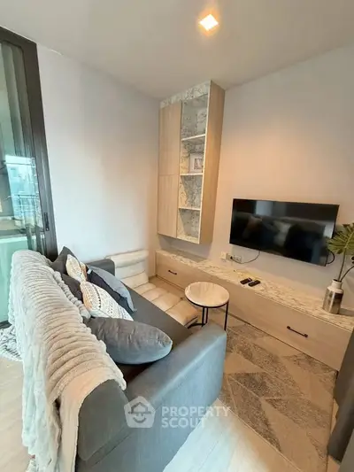 Cozy modern living room with stylish decor and wall-mounted TV