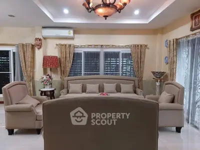 Elegant living room with plush seating and ambient lighting, perfect for relaxation and entertaining guests.