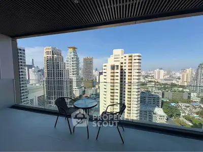 Stunning cityscape view from a high-rise balcony with modern seating.