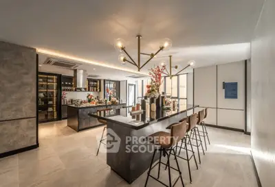 Luxurious modern kitchen with sleek island and stylish lighting, perfect for entertaining.