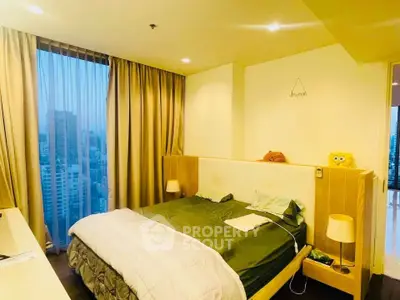 Cozy bedroom with city view and modern decor in high-rise apartment