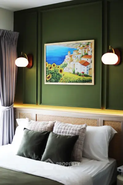 Elegant bedroom with green accent wall and stylish lighting