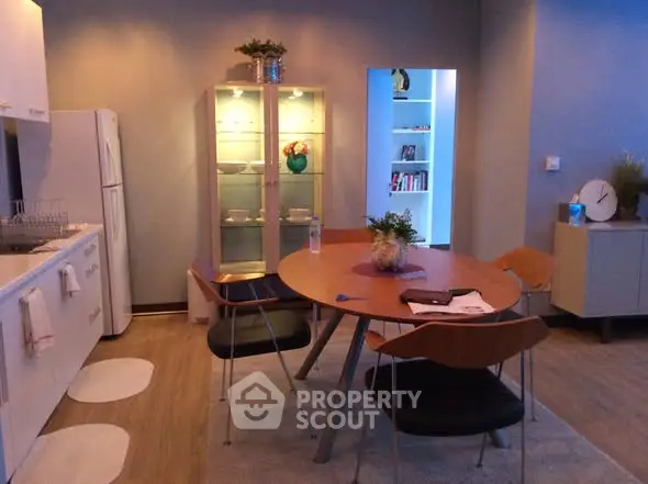 Modern kitchen with sleek dining area and stylish decor