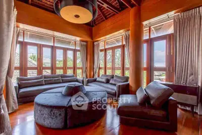 Luxurious living room with panoramic windows and elegant furniture