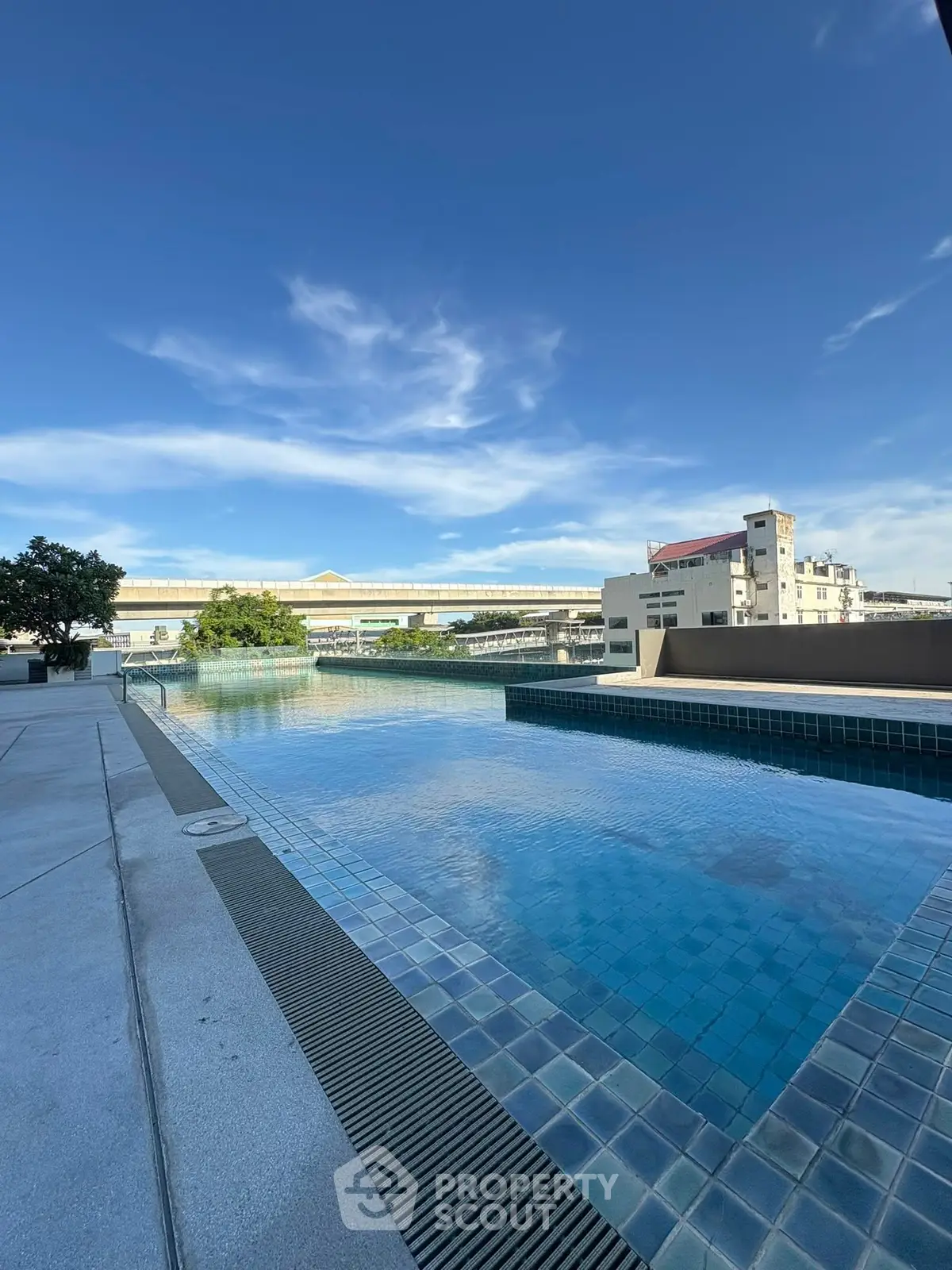 Stunning rooftop pool with panoramic city views and modern design, perfect for relaxation and leisure.