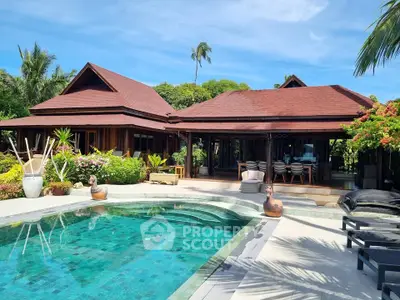 Luxurious tropical villa with private pool and lush garden, perfect for serene living and entertaining.
